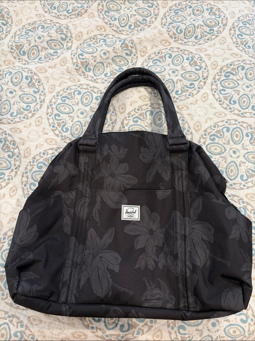 Herschel duffle bag with flower pattern